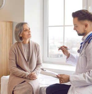 doctor and elderly woman talking