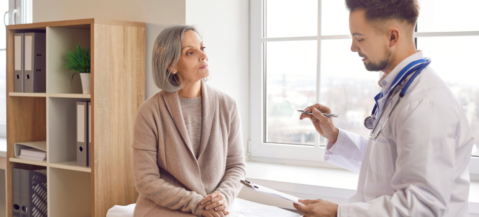 doctor and elderly woman talking