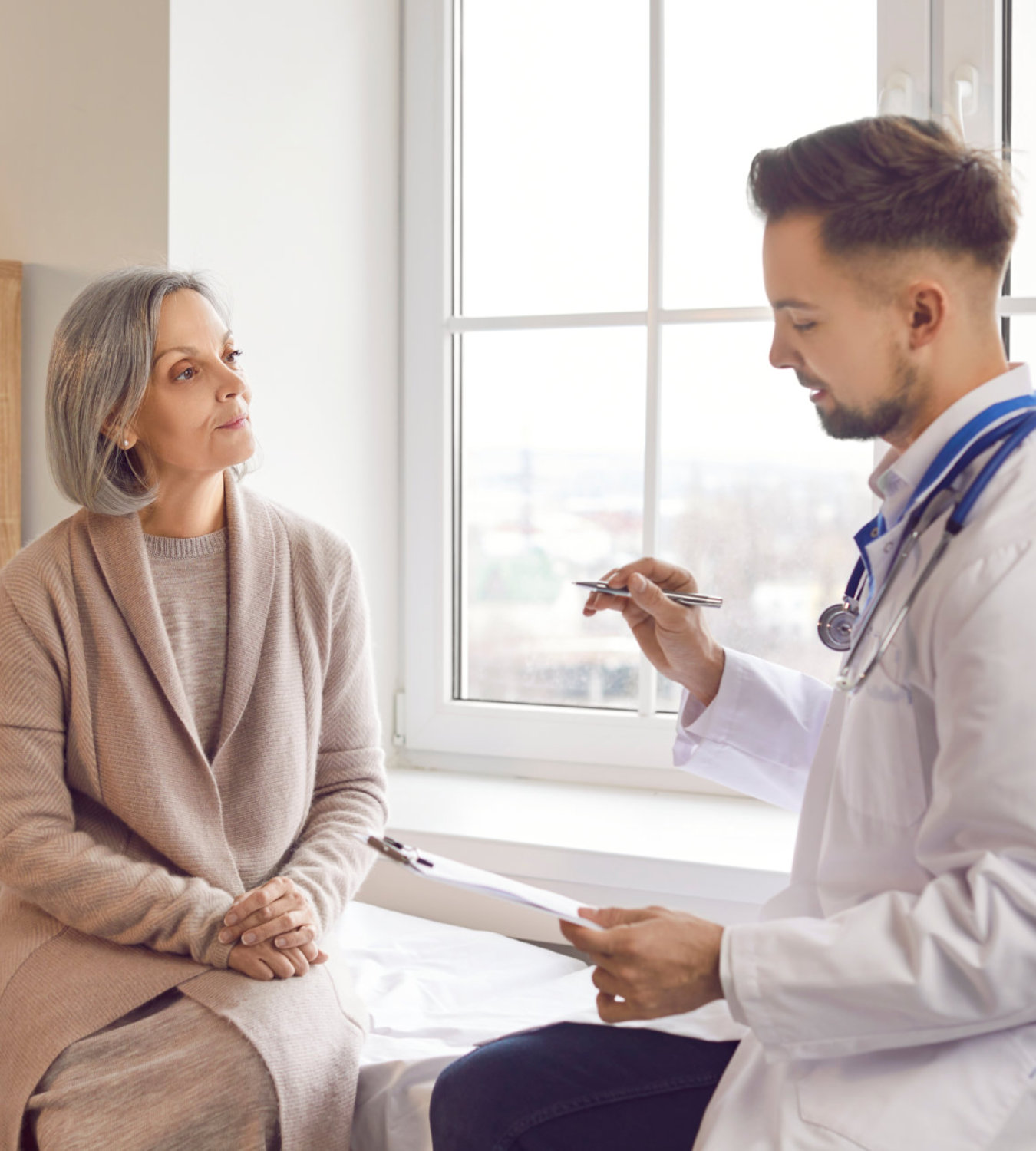 doctor and elderly woman talking